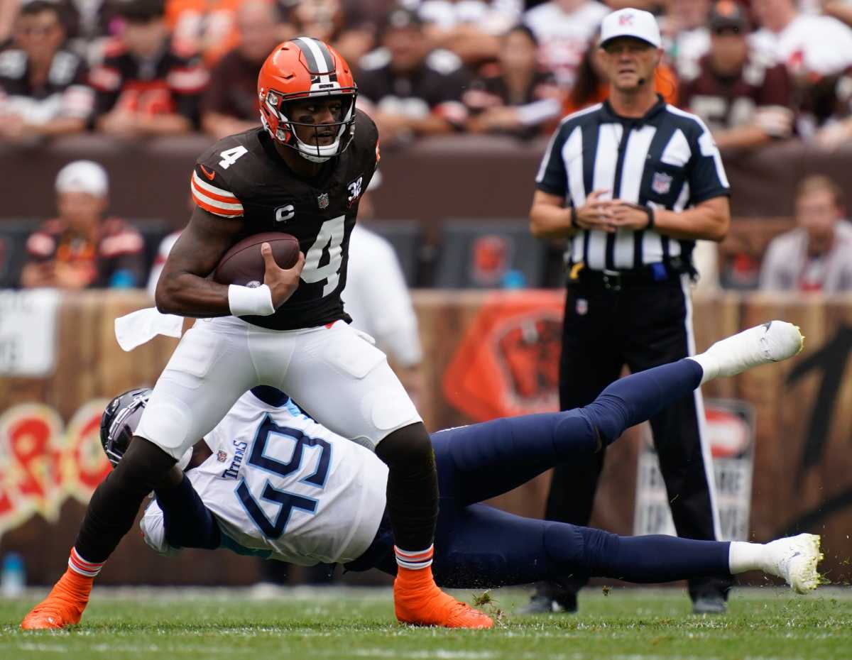 Cleveland Browns quarterback Deshaun Watson (4) gets away from Tennessee Titans linebacker Arden Key (49) during the first quarter in Cleveland, Ohio, Sunday, Sept. 24, 2023.